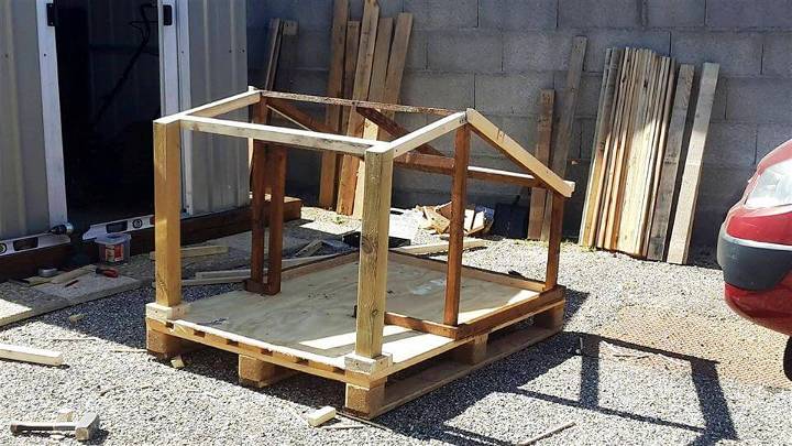 upcycled pallet dog house frame with veranda
