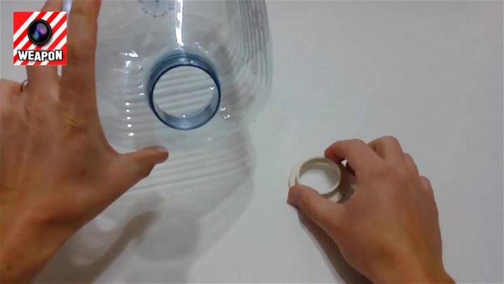 cut the mouth of the plastic bottle