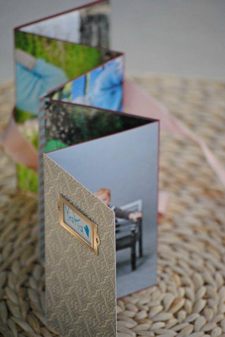 DIY Homemade Photo Album, photo albums may be expensive to by so you can consider making your photo albums like a pro at home just like this given one!