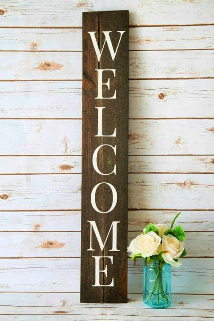 DIY Welcome Sign with a Silhouette, transfer the silhouette vinyl letters on a wooden board and make a porch welcome sign!