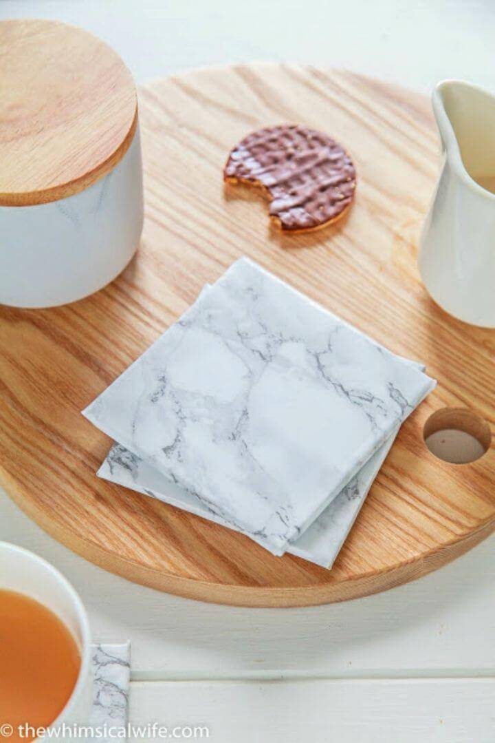 Easy DIY Marble Coaster, rock your party tables with the marbled coasters that you can make by using normal coasters which you can wrap then in the marble contact paper!