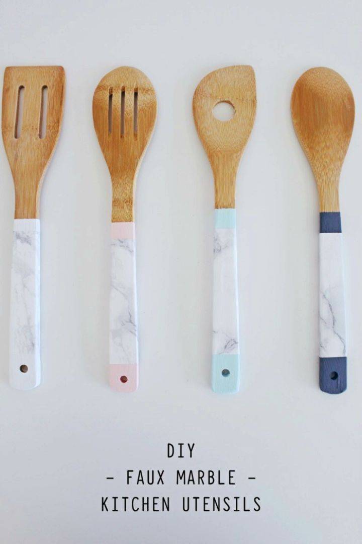 How to Make Faux Marble Kitchen Utensils, wrap also the marble contact paper all around the handles of wooden kitchen utensils and create a marble look of them!