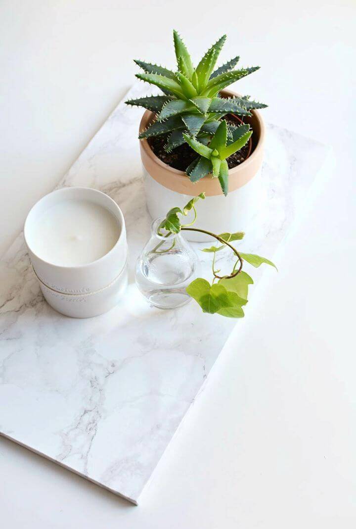 How to Make Marble Coffee Table Tray, also treat the coffee table trays with the marble contact paper to create a gorgeous marble appeal of them!