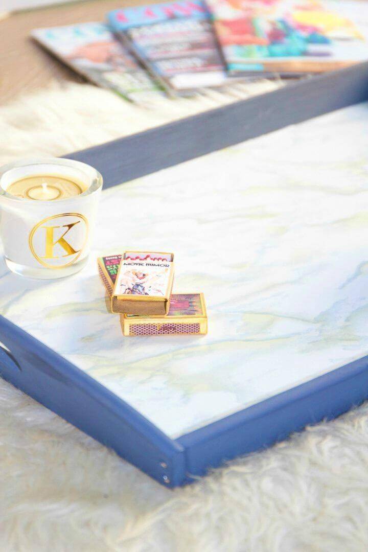 Simple DIY Faux Marble Ikea Tray, use the marble contact paper to create a faux marble appeal of anything thing like this tray!