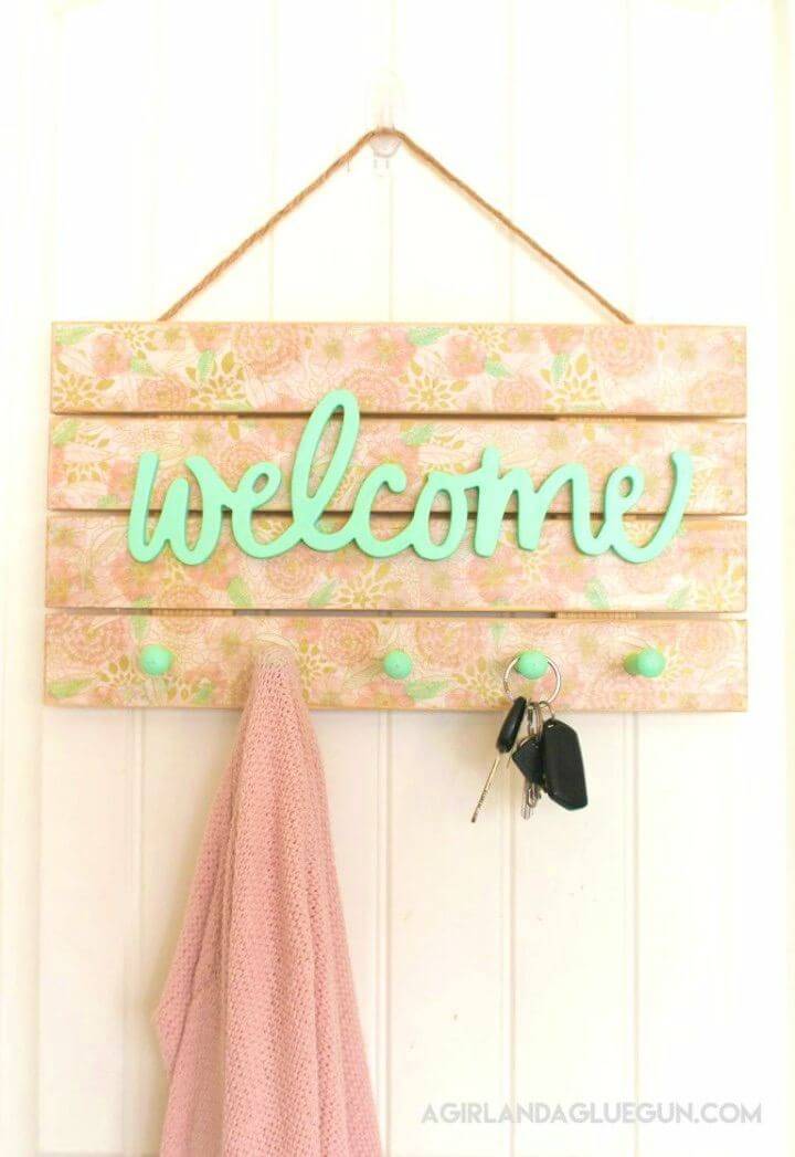 Simple DIY Floral Welcome Sign, Boost both the functional behavior and decor of your porch with this floral welcome sign that comes with hooks too!