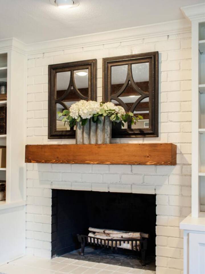 White Brick Fireplace with Wood Mantle