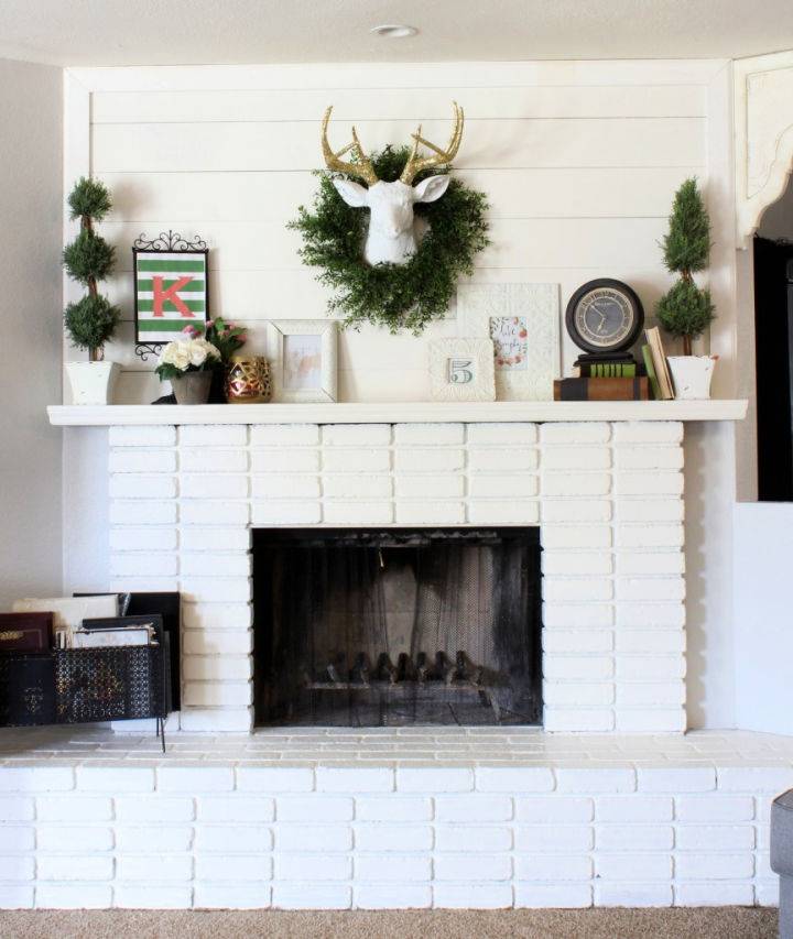 DIY White Brick Fireplace with Planked Mantle
