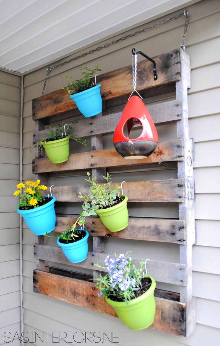 Vertical Pallet Garden With Colorful Pots