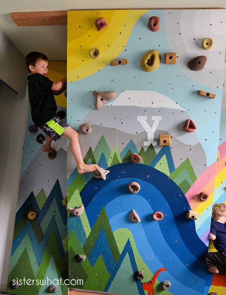 Kids Inside Rock Climbing Wall With Mural