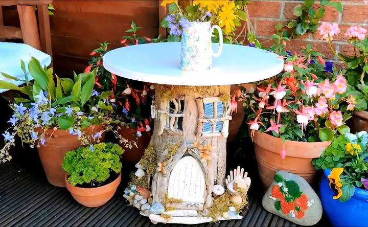 homemade tree stump fairy house