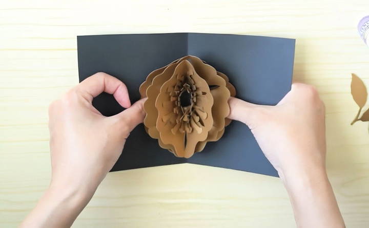 attach the flower to the card