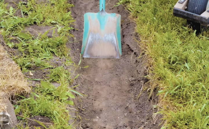 digging the trench for retaining wall