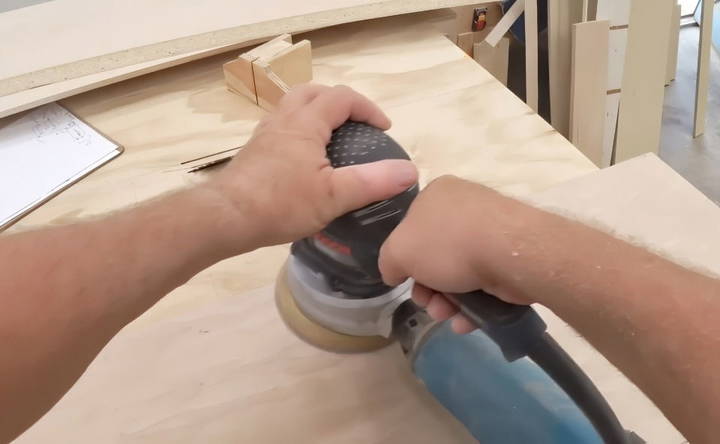 sanding the kitchen cabinet panels