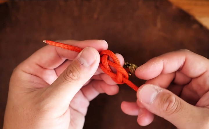 attach the bead and tie a diamond knot