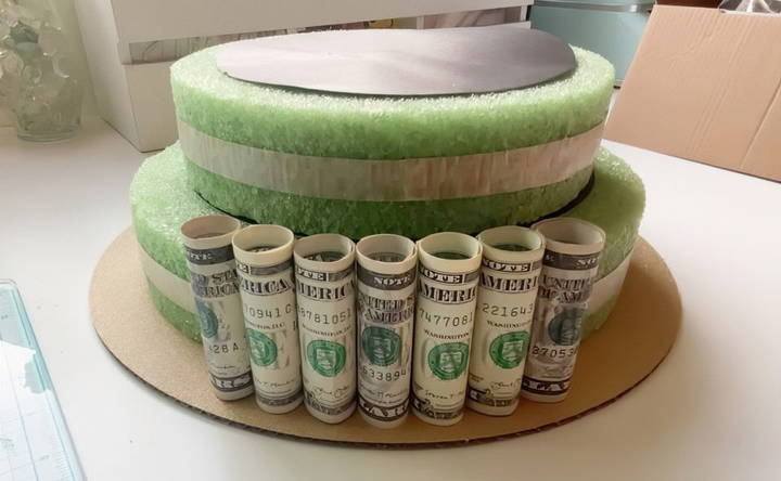 attach the money to the cake