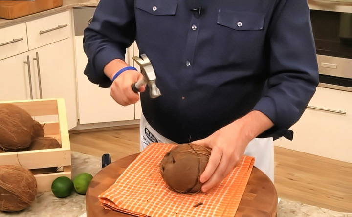 crack open the coconut using a hammer