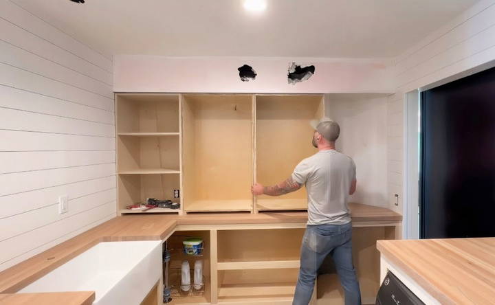 fitting the cabinets in the laundry room