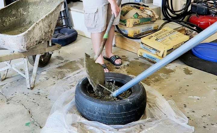 pouring concrete into tire