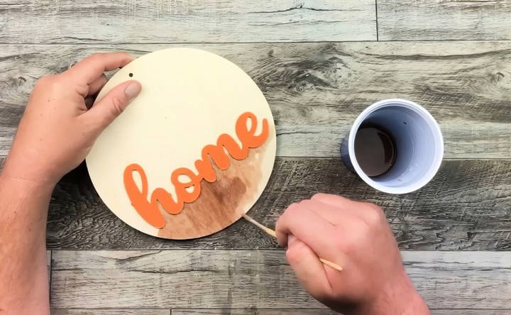 prepping the wooden round sign