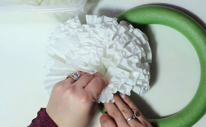 start attaching the filters to the wreath form