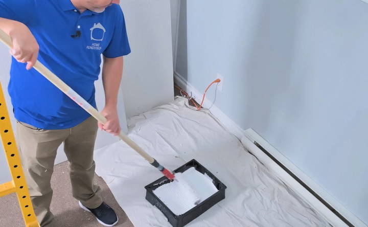 applying paint on the popcorn ceiling