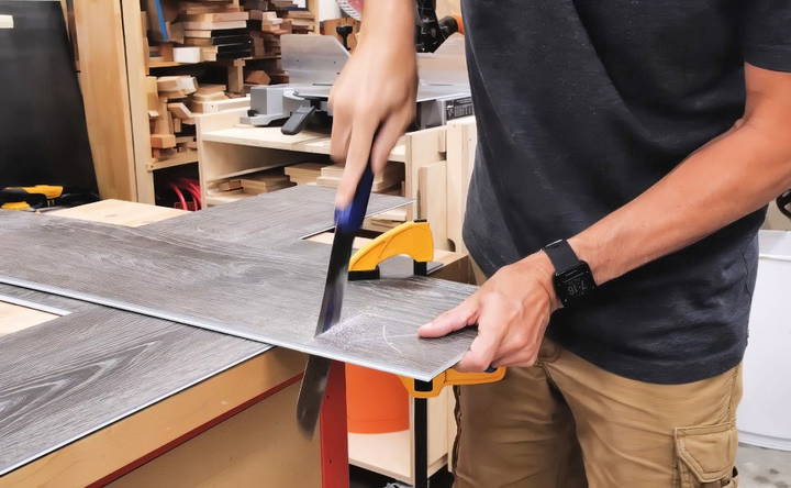 cut vinyl plank floor with a hand saw