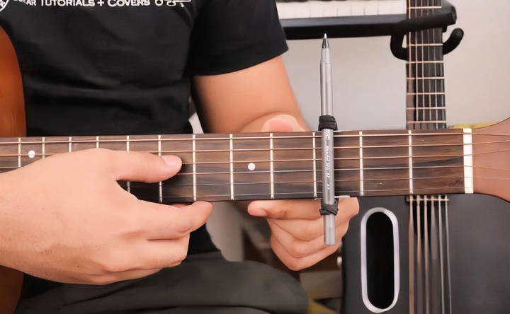 move the DIY capo to different frets