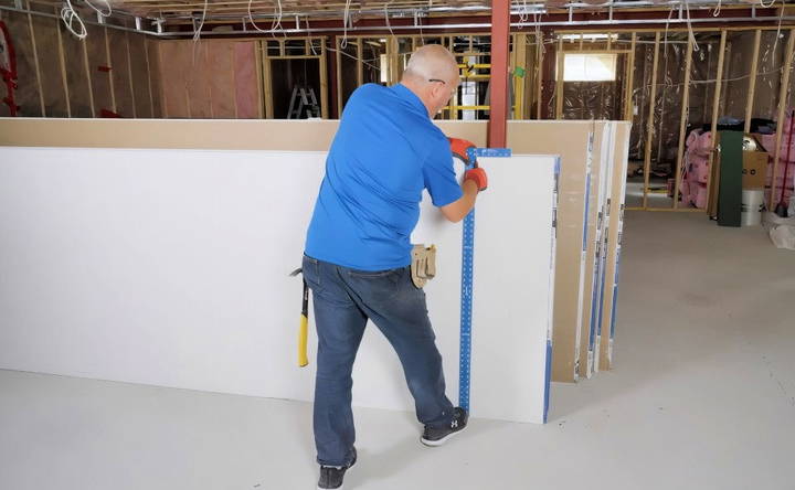 positioning and cutting the drywall sheets