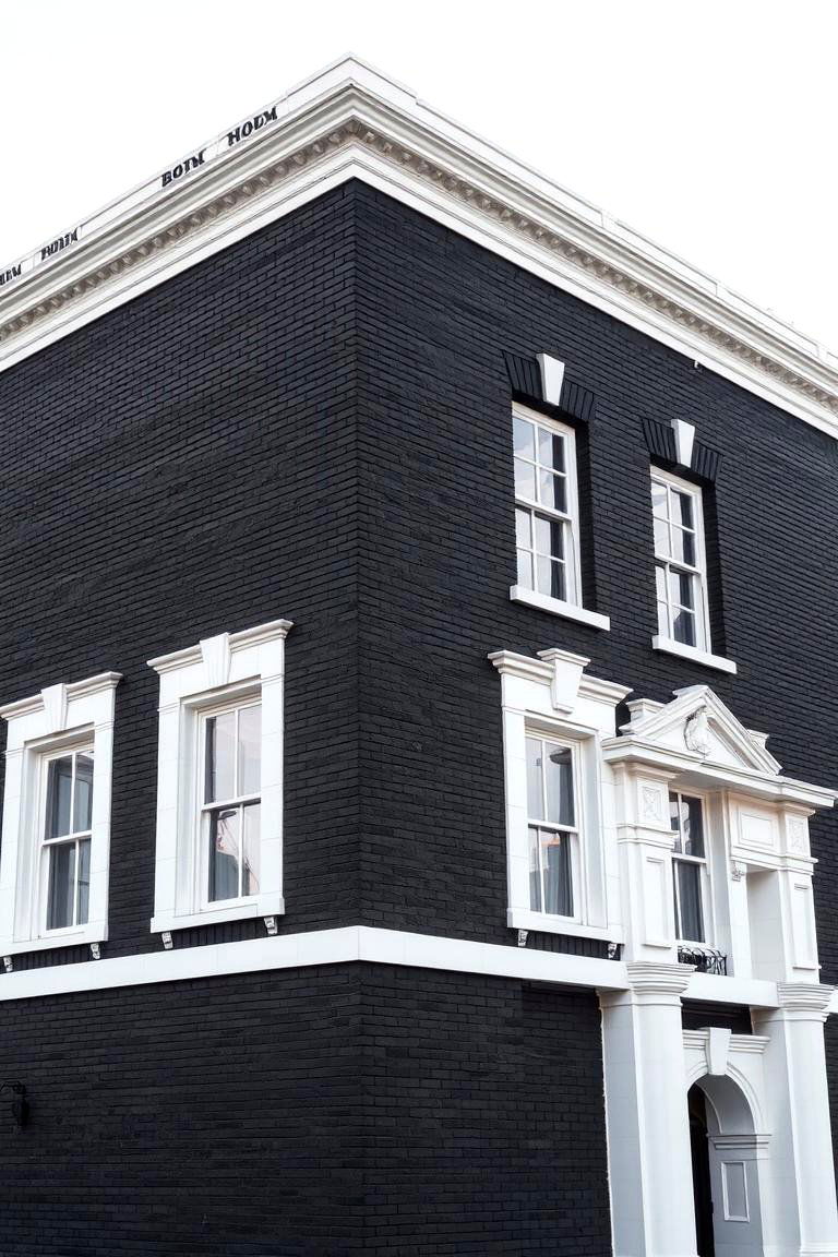 Bold Black Brick with Crisp White Details - 24 Exterior Brick and Paint Color Combinations