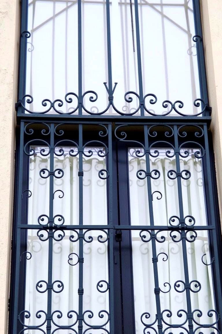 Intricate Iron Grilles - 24 spanish bungalow exterior ideas