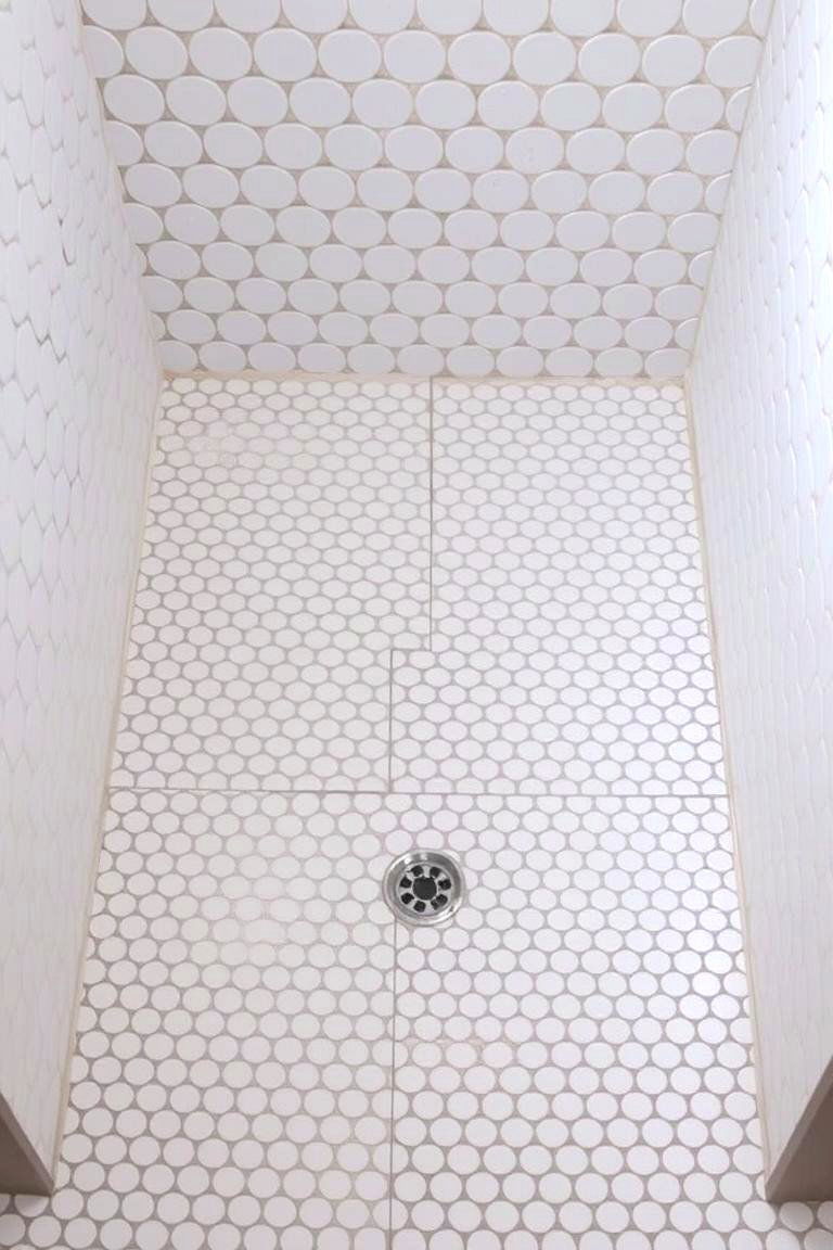 Penny Tile for a Retro Vibe - 24 Shower Floor Tile Ideas